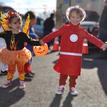 Kids in Halloween costumes at daycare center