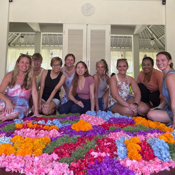 Janey Jewell on retreat in Bali posing by Mandala at Goddess Retreat