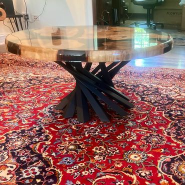 Translucent black epoxy pour with  Spalted White Oak.  Coffee table height approx. 40" round