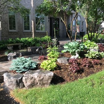 Beautiful residential landscaping design flowers green trees nursery plants rock custom professional