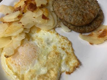 1 over easy egg, sausage patties, home fries