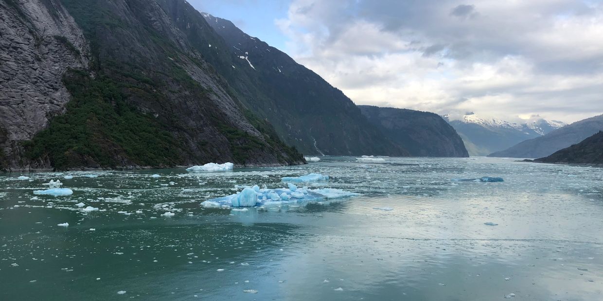 Alaska. Beautiful scenery, mountains, ice bergs, clouds, floating ice. 