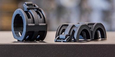 Image of a Clasp prototype design printed in Carbon Fiber material.