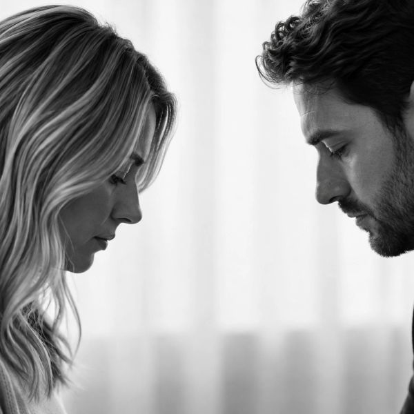 Profile of a man and woman looking down with serious expressions.