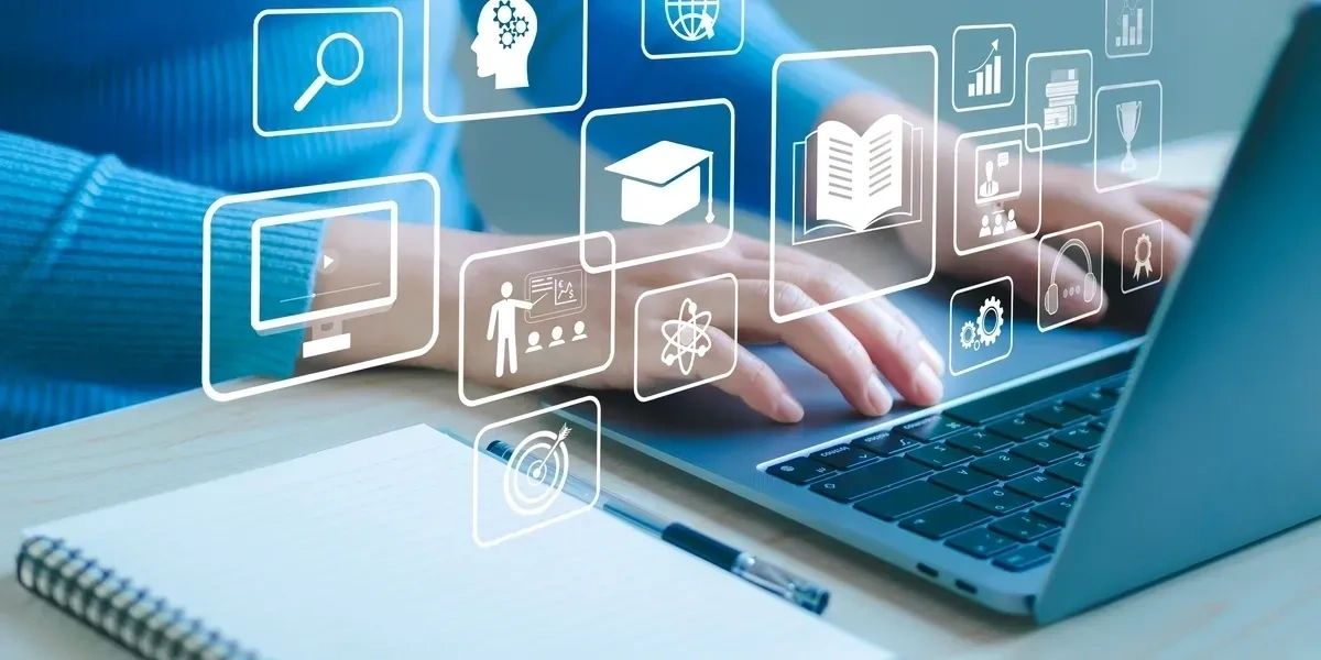 Person typing on a laptop surrounded by icons representing BCBA online course.