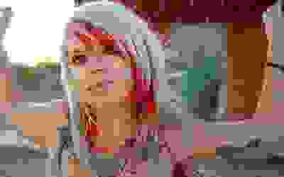 Girl with lip piercing and medusa piercing