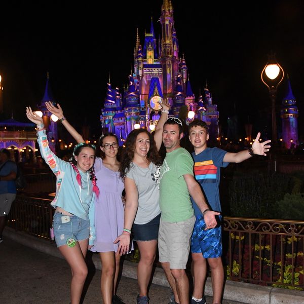 FTP Travel Specialist Ashley with family at Magic Kingdom in Walt Disney World. 