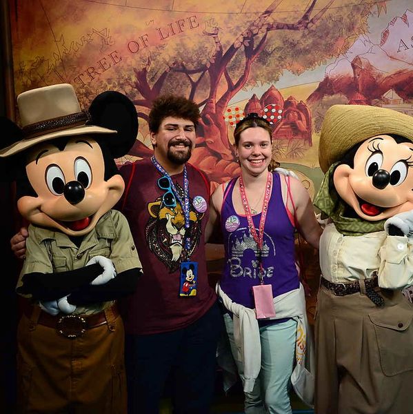 FTP Travel Specialist Marysa with husband, Mickey Mouse, and Minnie Mouse. 