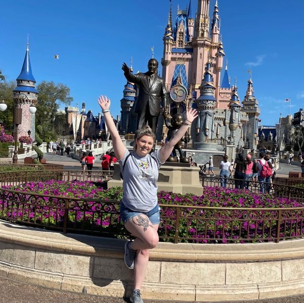 Travel Specialist LeeAnn in front of Cinderella's castle at Magic Kingdom
