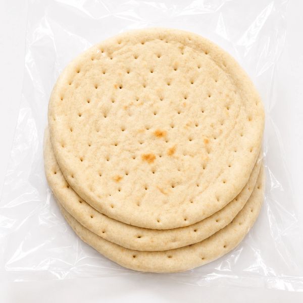 Three packaged pizza crusts in clear plastic.