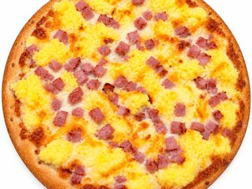 Breakfast pizza with scrambled eggs and ham.