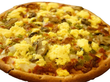 Breakfast pizza with scrambled eggs and vegetables.