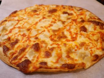 A close-up of a cheese pizza.