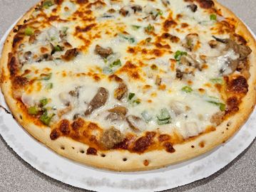 Cheesy pizza with mushrooms and green peppers.