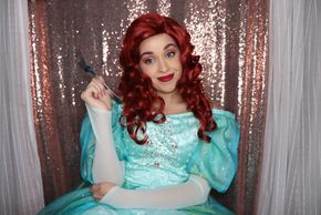 Ariel from disney little mermaid in a teal ballgown. Princess mermaid video call.