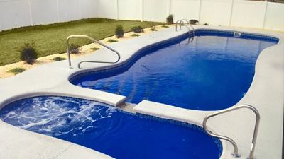 pool installed by armstrong pools & outdoors - daydream with hot tub
