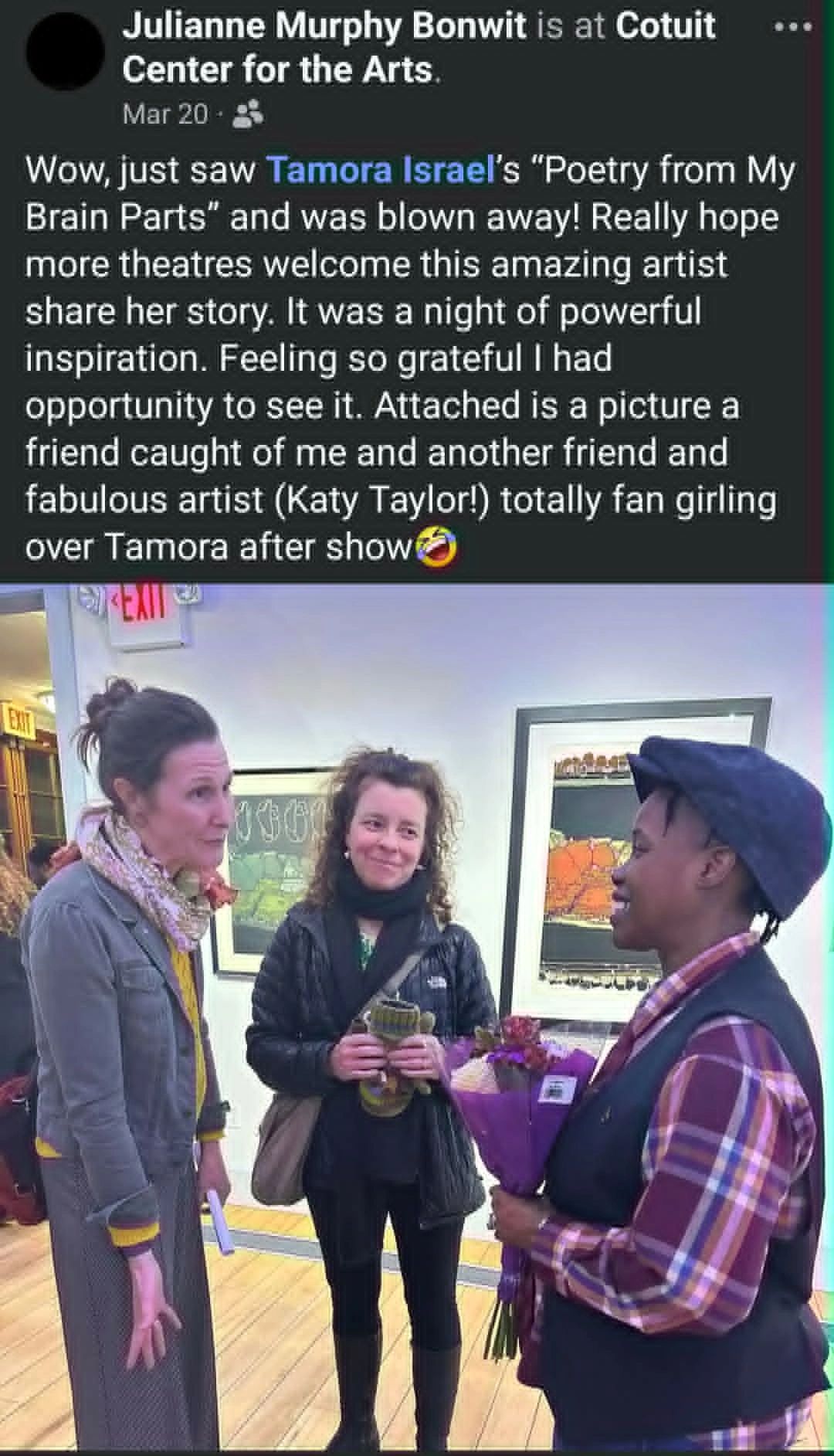 Three women engaged in conversation at an art center.