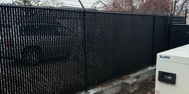 Chain-link fencing with black slats