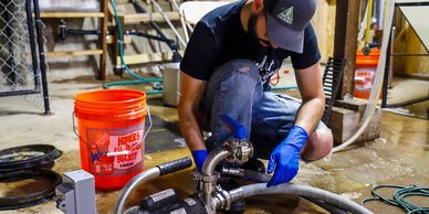 Photo of Brewer changing lines on a pump.