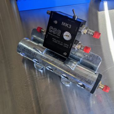 MK3 CSG mechanical device with gauges and red caps.