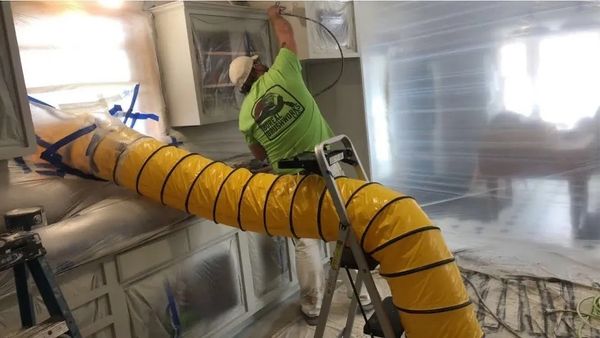 Kitchen cabinets being painted by Boreal Brushworks