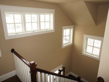 Stairs going upwards with some windows