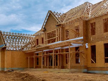 Construction work going in a house with woods