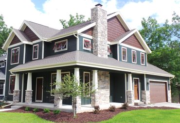 Folk National 2 story with wrap around porch for a corner lot.  Red windows