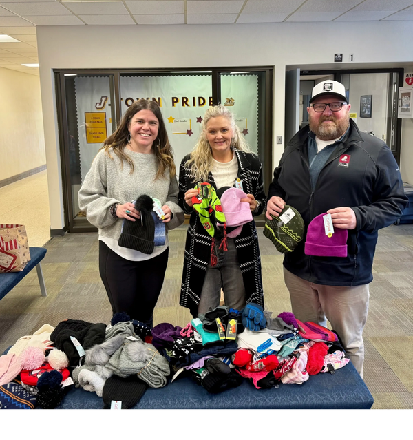Commercial Club Members and Jordan School Staff pose for picture at Annual Mitten Drive