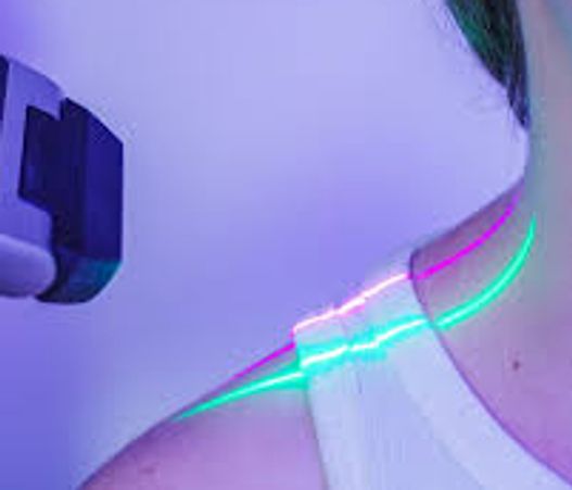 Laser device scanning a person's shoulder and neck area.