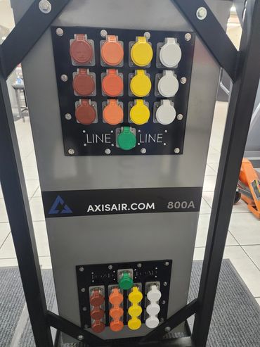 Color-coded industrial air hose connections on a metal panel labeled AXISAIR 800A.
