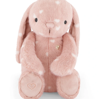 Soft pink plush bunny with white spots and a heart on its paw.