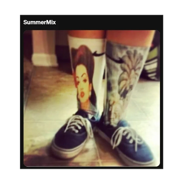 Socks with detailed face and abstract designs paired with navy sneakers.