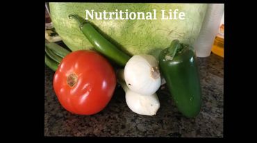 Fresh vegetables including tomato, onion, and peppers.