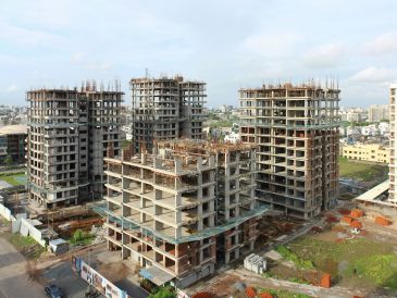 Under-construction high-rise buildings in an urban area.