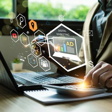 Person using calculator and laptop with digital marketing icons floating.