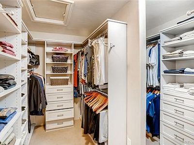 Picture of organized master closet.