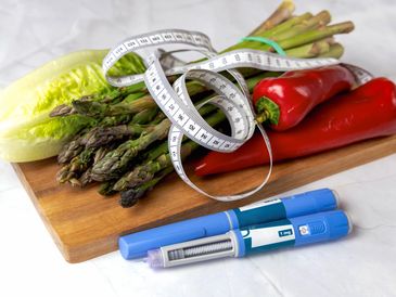fruits, vegetables, measuring tape and Ozempic Pen