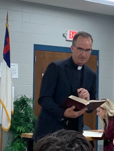 Pastor Shoup leading chapel.