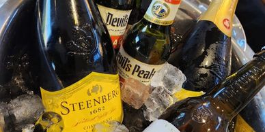 Bubbly and Beer in cooler with ice.
