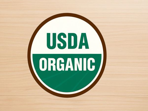 USDA Organic logo on wooden background.
