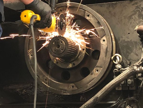 A Man Welding the Machine