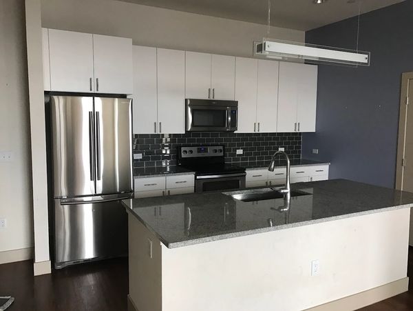 Modern kitchen with stainless steel appliances and white cabinets.
Residential cleaning 
Commercial cleaning
Janitorial services