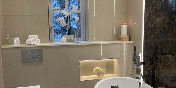 Modern bathroom with freestanding tub and elegant decor.