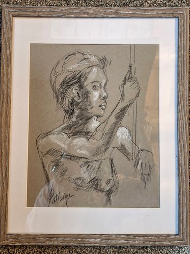charcoal and pastel drawing of a nude woman leaning on a staff.