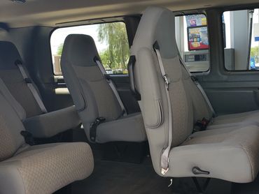 The Interior Section Of A Van With White Color Seating, metro phoenix airport transportation mesa