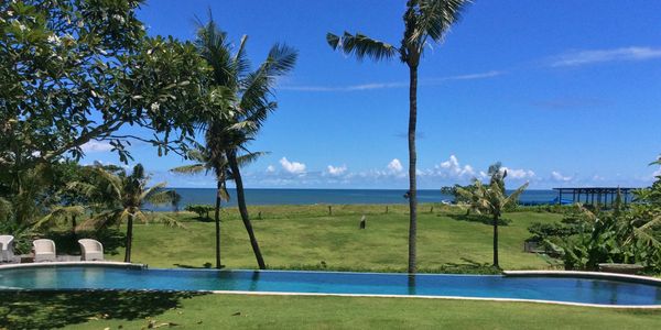 Grass, trees and ocean.