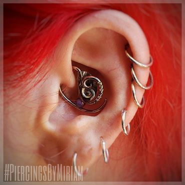 Daith piercing by Miriam with a custom creation by Noah @ Interstellar Jewelry Productions