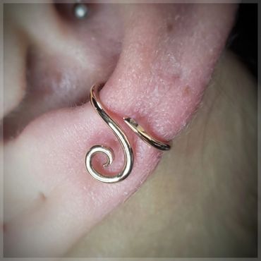 Conch piercing by Miriam with a 14kt rose gold “regulus” handmade by Interstellar jewelry production