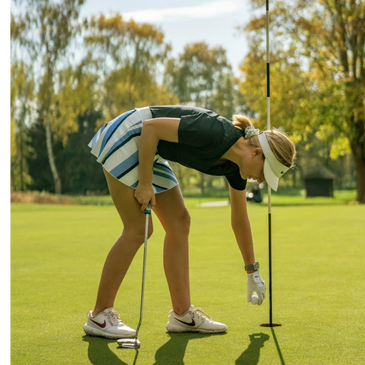 Golf putt goes in the hole